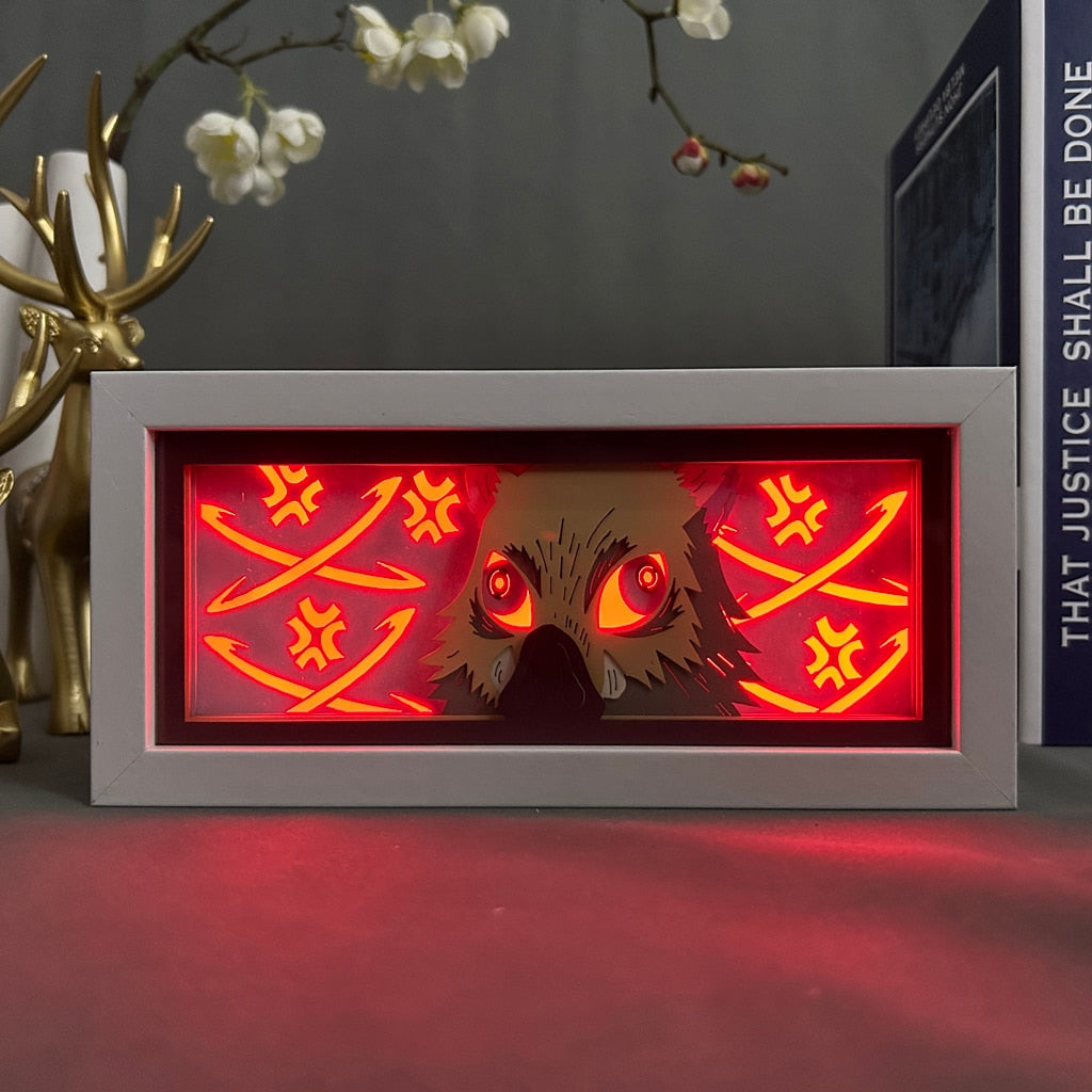 Layered cut paper lamp featuring Inosuke Hashibira on red light setting