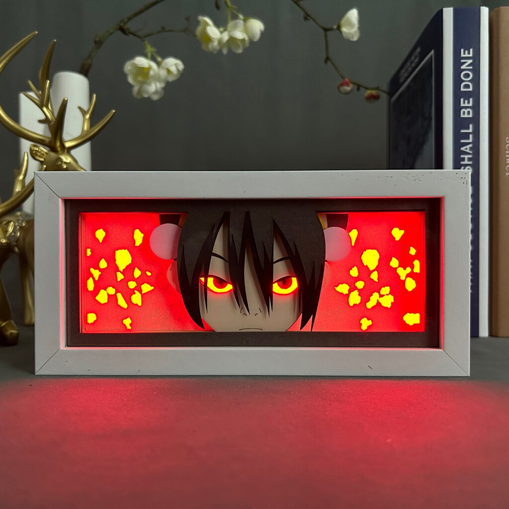 Layered cut paper lamp featuring Toph Beifong on red light setting