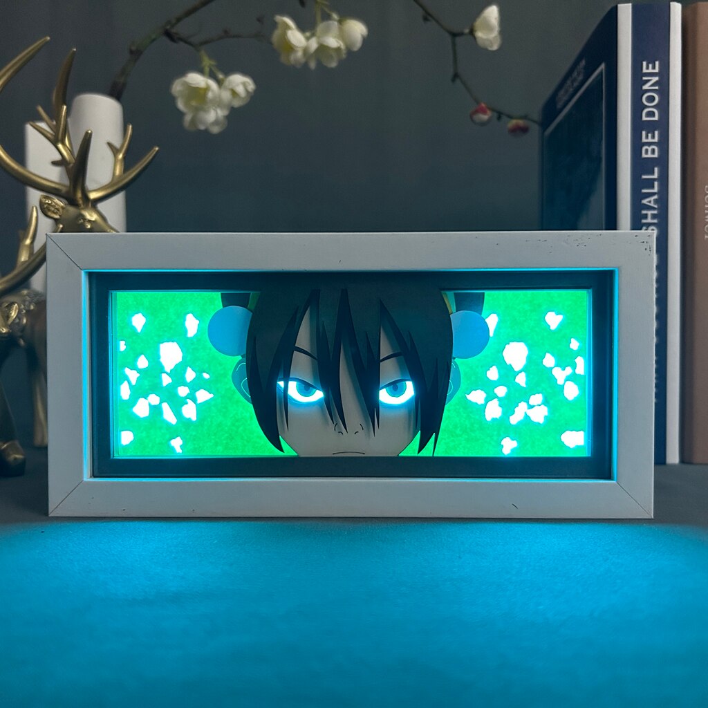 Layered cut paper lamp featuring Toph Beifong on cyan light setting