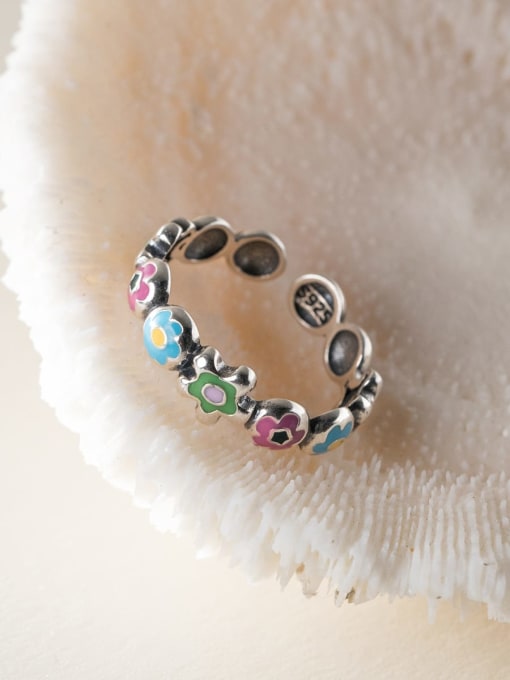 Sterling Silver, open-back ring featuring pink, blue, and green enamel flowers