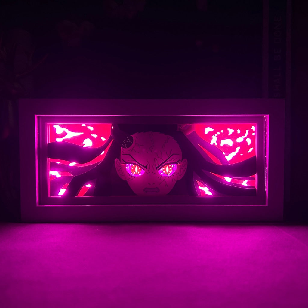 Layered cut paper lamp featuring Nezuko Kamado on pink light setting in a dark room